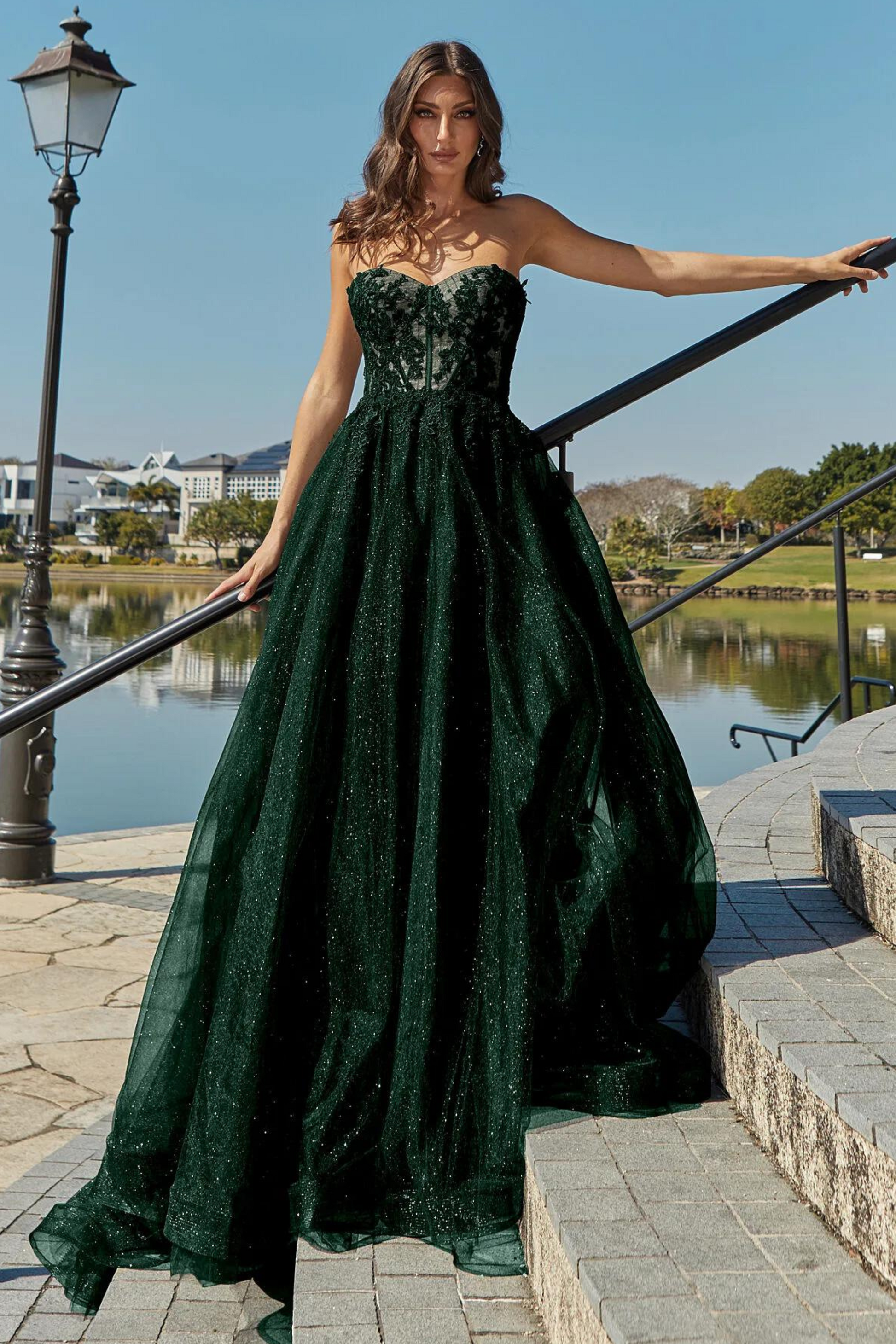 Tania Olsen a-line formal dress with embroidered lace bodice and tulle and glitter skirt in emerald